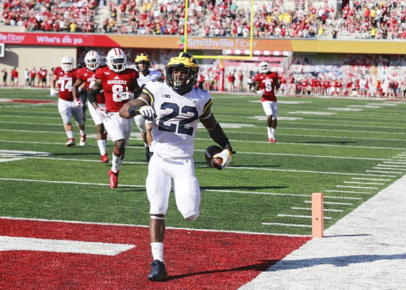 Karan Higdon (22) and John O'Korn (8)