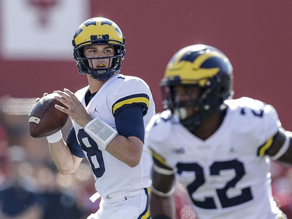John O'Korn (8) and Karan Higdon (22)