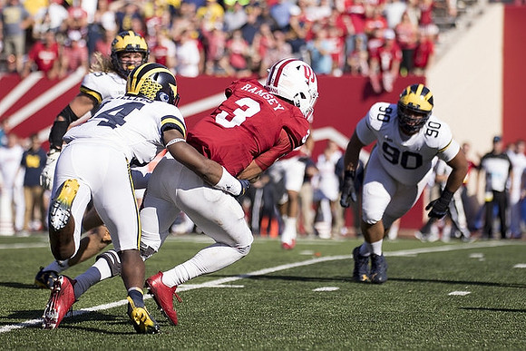 Chase Winovich (15), Josh Metellus (14), and Bryan Mone (90)