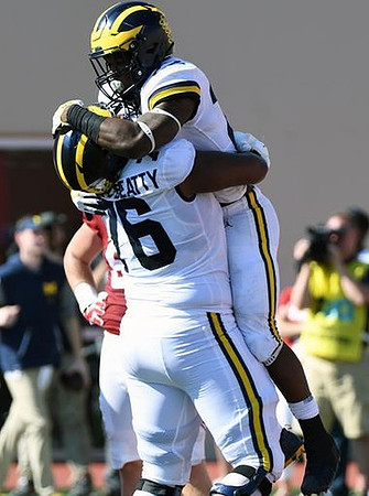 Juwann Bushell-Beatty (76) and Karan Higdon (22)