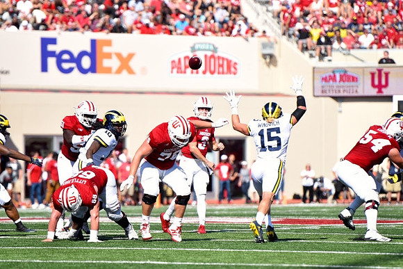 Devin Bush (10) and Chase Winovich (15)