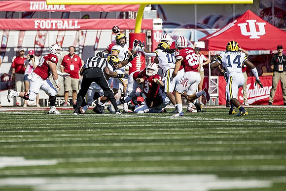 Chase Winovich (15), Devin Bush (10), and Josh Metellus (14)
