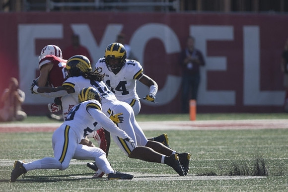 Brandon Watson (28), Devin Bush (10), and Josh Metellus (14)