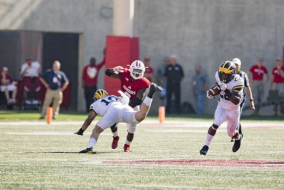 Henry Poggi (19) and Karan Higdon (22)