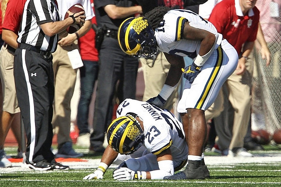 Tyree Kinnel (23) and Devin Bush (10)