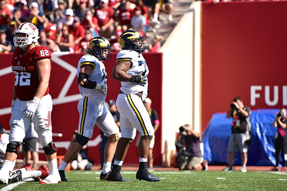 Chase Winovich (15) and Maurice Hurst (73)
