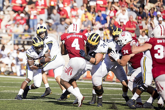 Karan Higdon (22), John O'Korn (8), Ben Bredeson (74), and Ian Bunting (89)