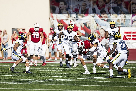 Khaleke Hudson (7), Chase Winovich (15), Maurice Hurst (73), Tyree Kinnel (23), Rashan Gary (3), and David Long (22)