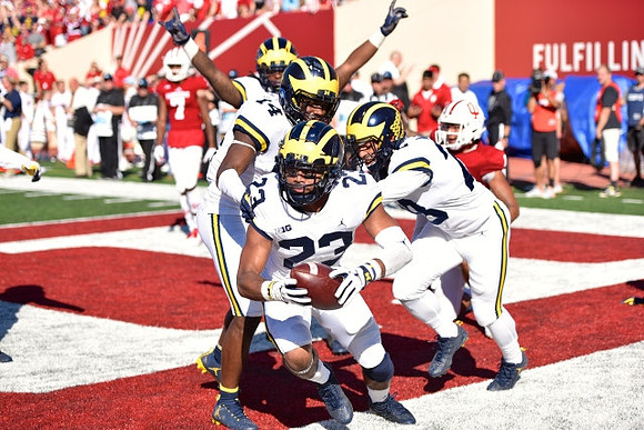 Tyree Kinnel (23), Josh Metellus (14), and Brandon Watson (28)