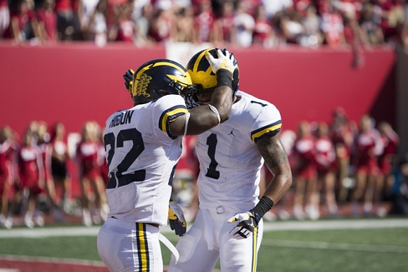 Karan Higdon (22) and Kekoa Crawford (1)