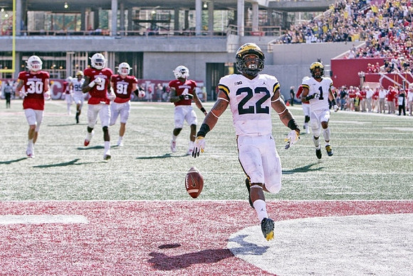 Karan Higdon (22) and Kekoa Crawford (1)