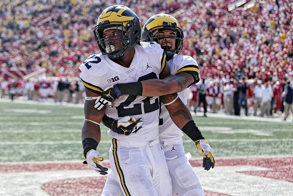 Karan Higdon (22) and Kekoa Crawford (1)