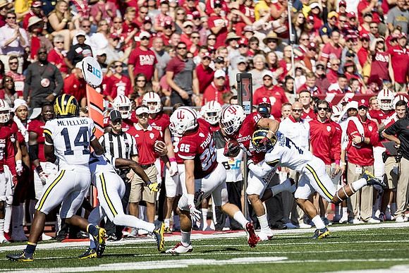 Josh Metellus (14) and Khaleke Hudson (7)