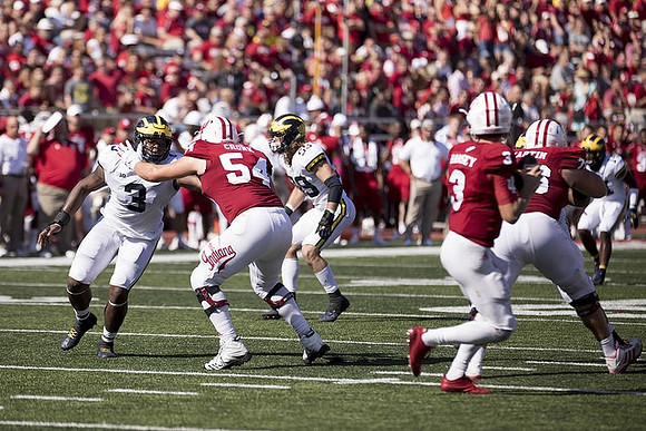 Rashan Gary (3) and Noah Furbush (59)
