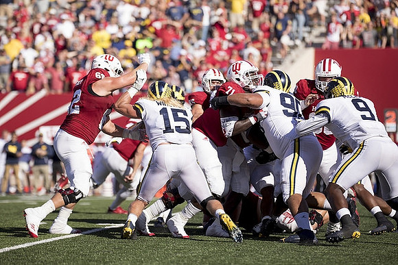 Chase Winovich (15), Bryan Mone (90), and Mike McCray (9)