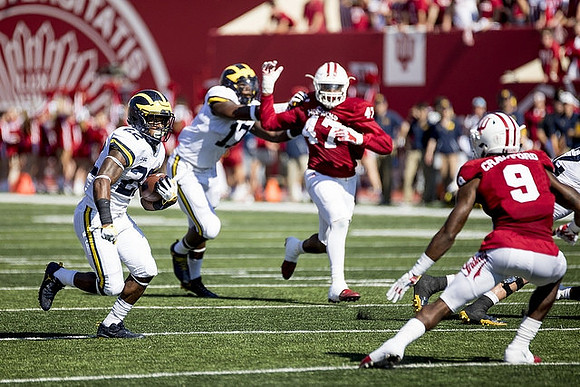 Karan Higdon (22) and Tyrone Wheatley Jr. (17)