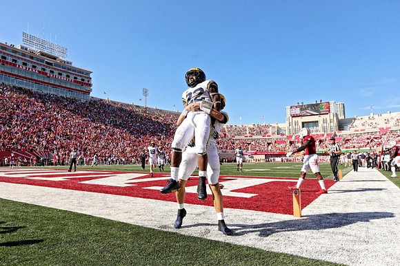 Karan Higdon (22) and John O'Korn (8)