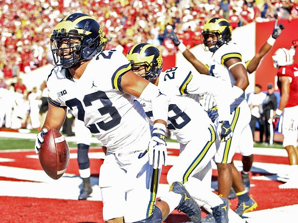 Tyree Kinnel (23), Brandon Watson (28), and Josh Metellus (14)