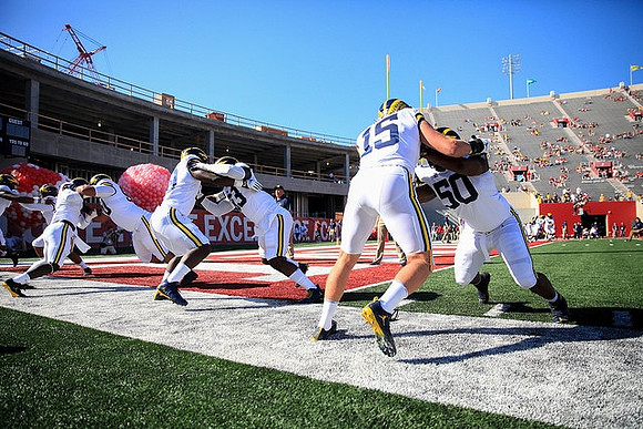 Chase Winovich (15) and Michael Dwumfour (50)