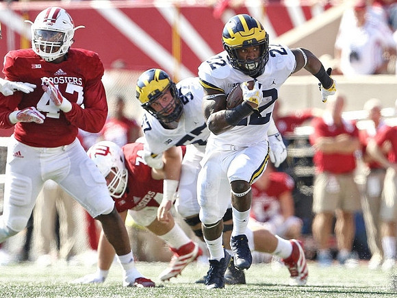 Karan Higdon (22) and Patrick Kugler (57)