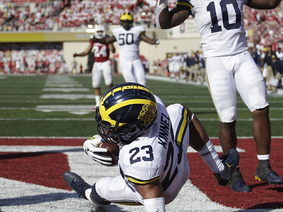 Tyree Kinnel (23), Devin Bush (10), and Michael Dwumfour (50)