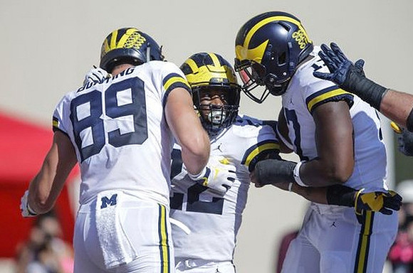 Ian Bunting (89), Karan Higdon (22), and Tyrone Wheatley Jr. (17)