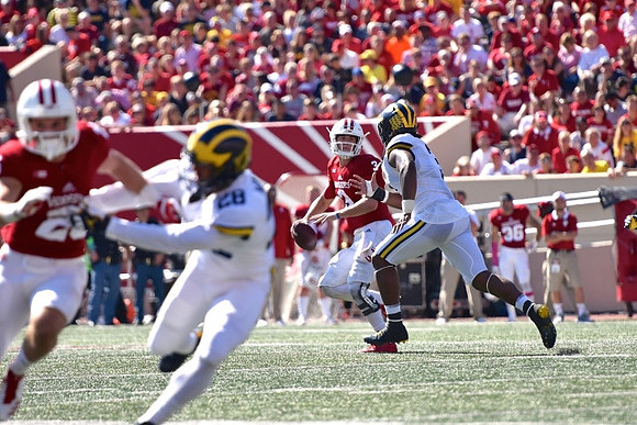 Brandon Watson (28) and Rashan Gary (3)