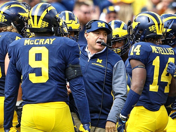 Mike McCray (9), Don Brown, and Josh Metellus (14)