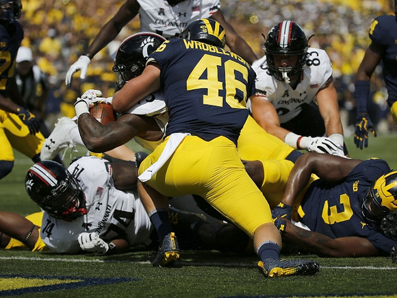 Michael Wroblewski (46) and Rashan Gary (3)