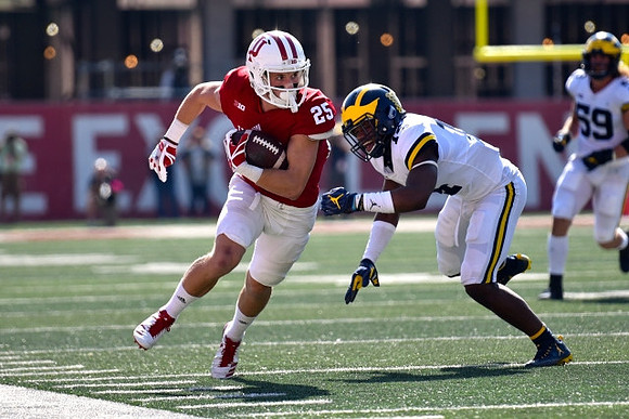Josh Metellus (14) and Noah Furbush (59)