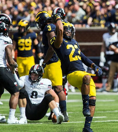 Noah Furbush (59), Rashan Gary (3), and Tyree Kinnel (23)