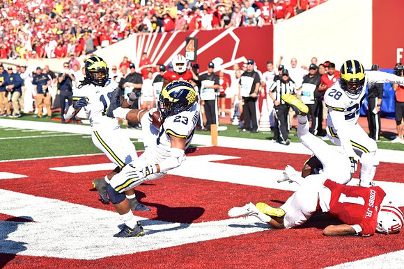 Devin Bush (10), Tyree Kinnel (23), and Brandon Watson (28)