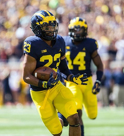 Tyree Kinnel (23) and Josh Metellus (14)