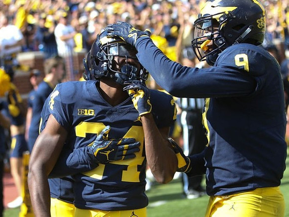Lavert Hill (24) and Mike McCray (9)