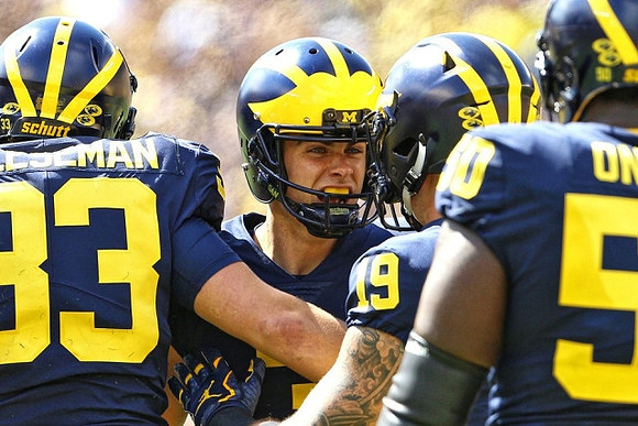 Camaron Cheeseman (33), Quinn Nordin (3), Henry Poggi (19), and Michael Onwenu (50)