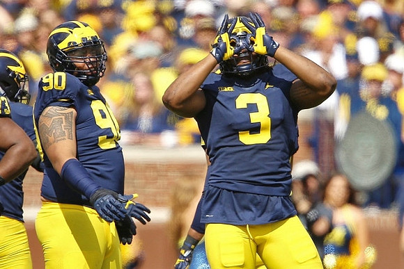 Bryan Mone (90) and Rashan Gary (3)