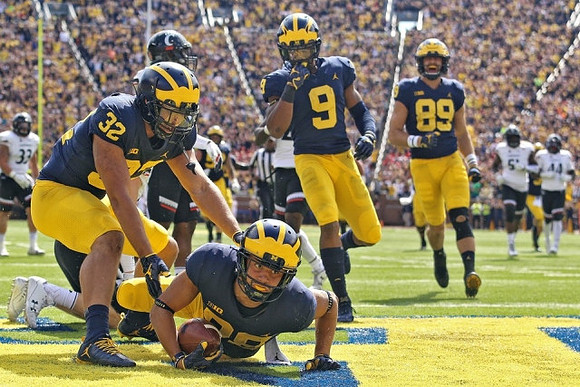 Ty Isaac (32), Grant Perry (88), Donovan Peoples-Jones (9), and Ian Bunting (89)