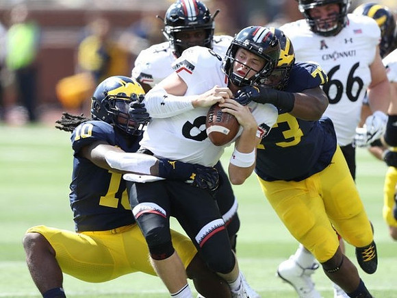 Devin Bush (10) and Tyree Kinnel (23)
