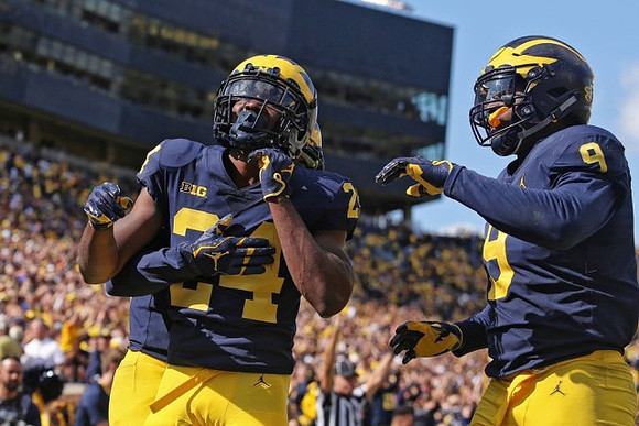 Lavert Hill (24) and Mike McCray (9)