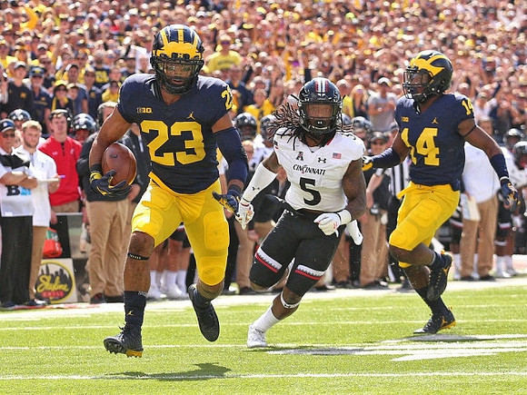 Tyree Kinnel (23) and Josh Metellus (14)