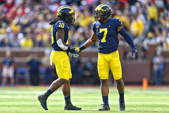 Devin Bush (10) and Khaleke Hudson (7)