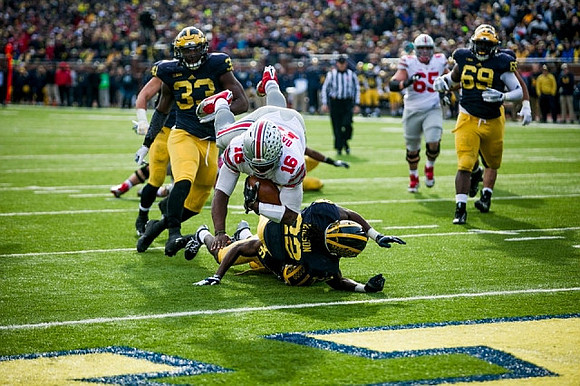 Taco Charlton (33), Jourdan Lewis (26), Jarrod Wilson (22), and Willie Henry (69)
