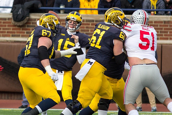 Kyle Kalis (67), Jake Rudock (15), and Graham Glasgow (61)