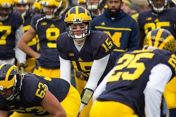 Ben Pliska (63), Jake Rudock (15), and Dymonte Thomas (25)