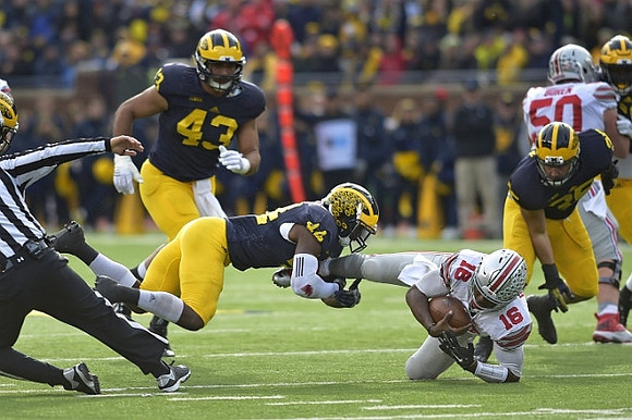 Chris Wormley (43), Delano Hill (44), and Joe Bolden (35)