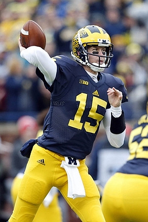 Jake Rudock (15) and Mason Cole (52)