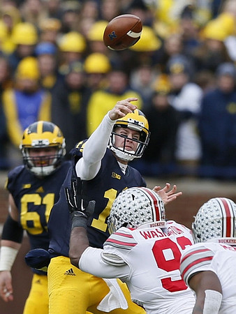 Graham Glasgow (61) and Jake Rudock (15)