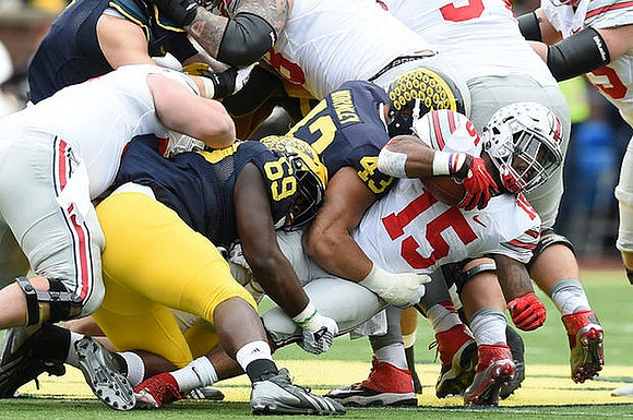 Willie Henry (69) and Chris Wormley (43)