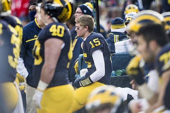 Nick Volk (40) and Jake Rudock (15)
