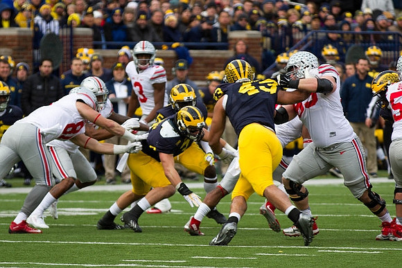 Desmond Morgan (3), Jabrill Peppers (5), and Chris Wormley (43)